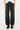 The model is wearing a size 26
